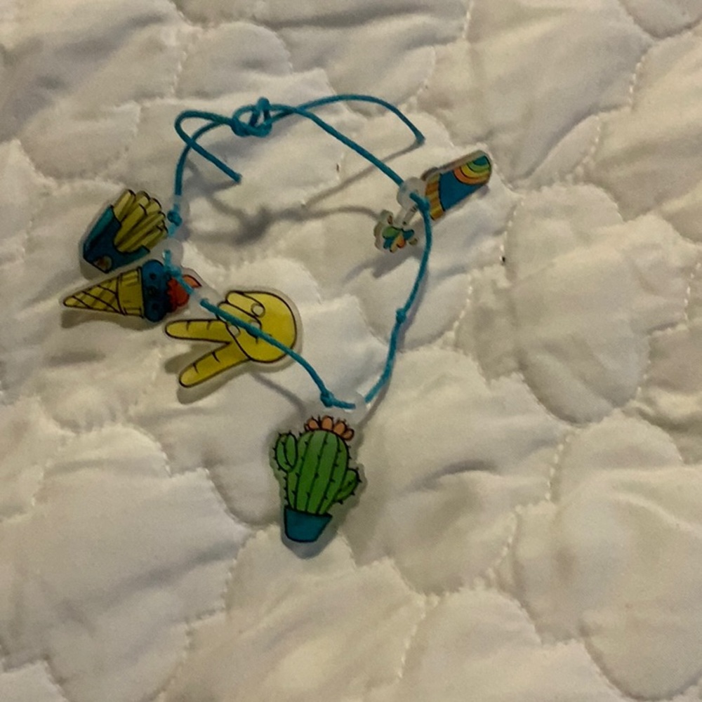 I am selling a blue bracelet with charms on it this bracelet is homemade.